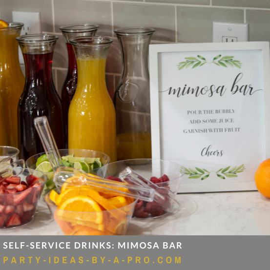 carafes of juice and garnishes for a mimosa bar