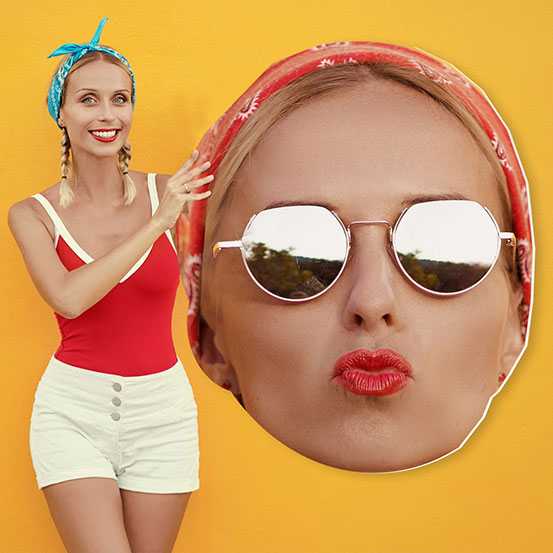 woman holding 3ft big head cut out of her own head