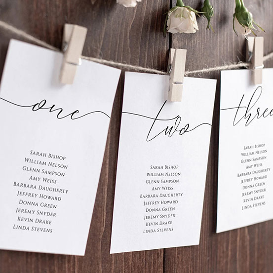 editable and printable wedding seating plan cards pegged to twine