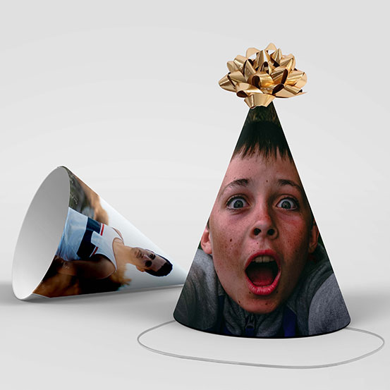 two color photo party hats, one showing the birthday boy as a teenage and one as a kid