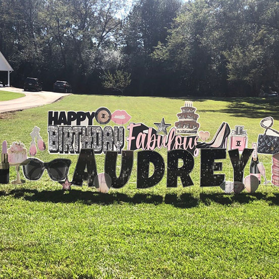 Happy Birthday Audrey yard card on front lawn of house