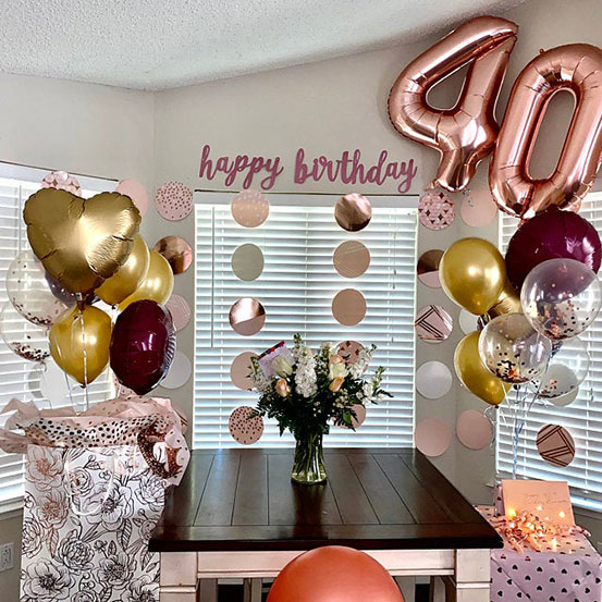 Giant rose gold number 40 balloons and other birthday decorations