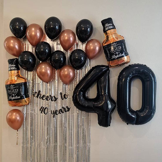 Giant black number 40 balloons and other decorations
