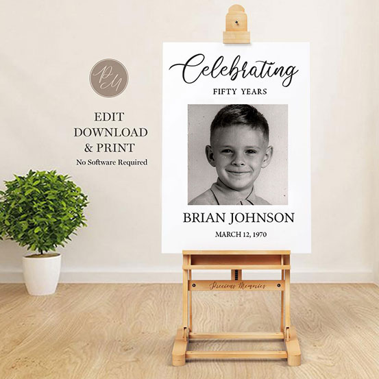 celebrating 50 years sign with photo of birthday boy as a baby displayed on an easel