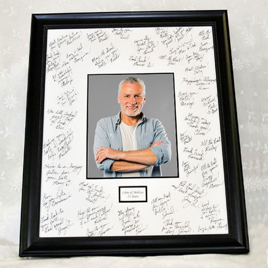 custom 60th birthday framed signing poster guestbook alternative with photo of birthday boy surrounded by handwritten messages