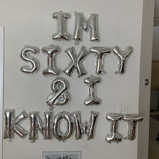176 Cat Years Old letter balloons on wall