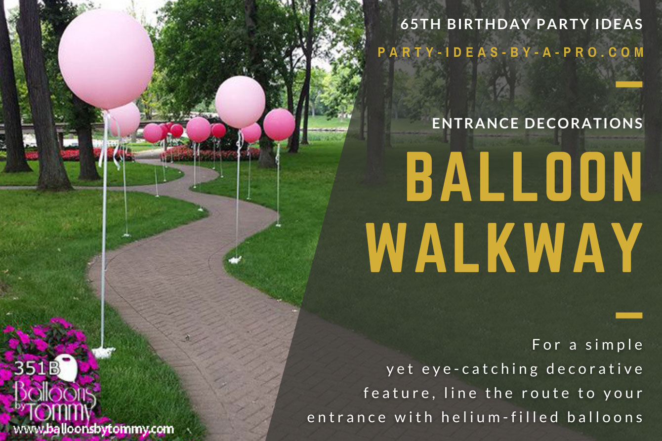 pink helium balloon lined walkway through a park