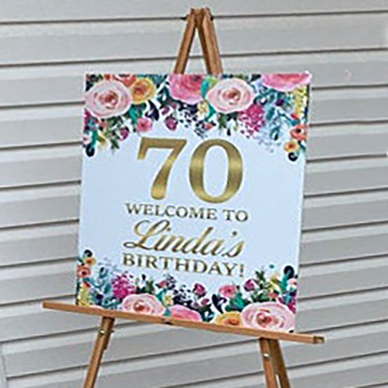 Forty & Fabulous 70th Birthday custom name welcome sign with floral design on an easel