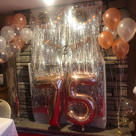 Giant number 75 balloons and other birthday decorations