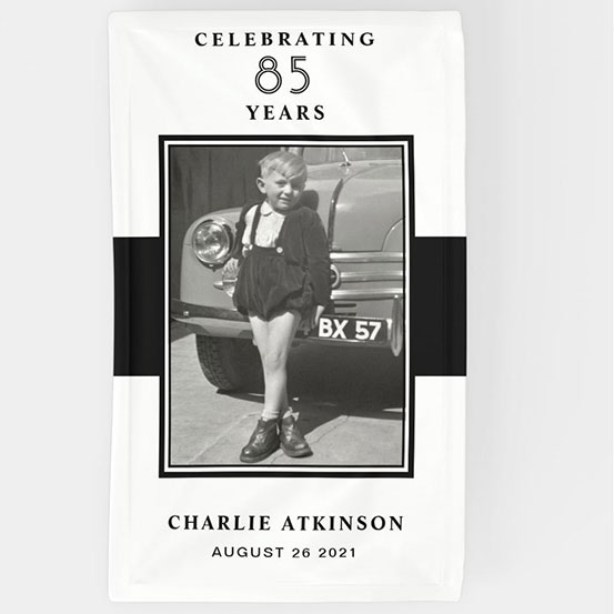 Celebrating 85 years custom photo banner showing birthday boy as a baby