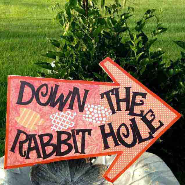 down the rabbit hole sign