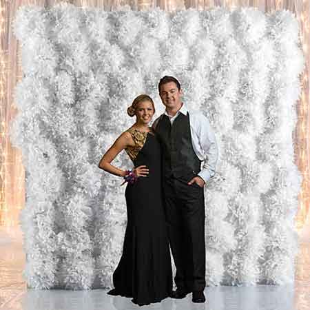 photo booth backdrop board with tissue poms