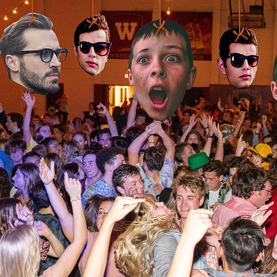custom big heads of birthday boy as baby, kid, and adult hanging from ceiling above dancefloor full of people