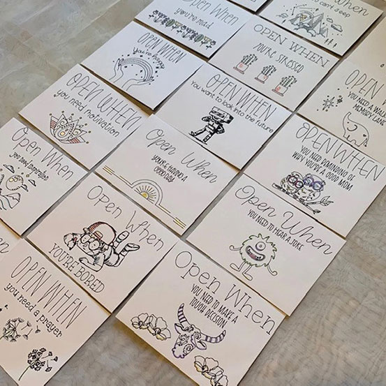selection of open when letters with illustrated envelopes for occasians