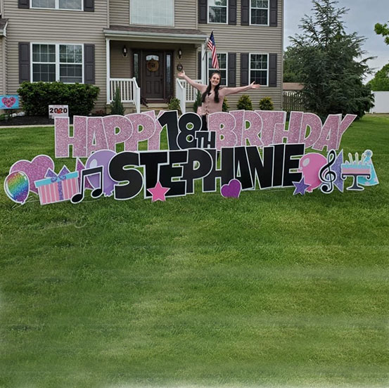 Happy 18th Birthday Mike yard card on front lawn of house