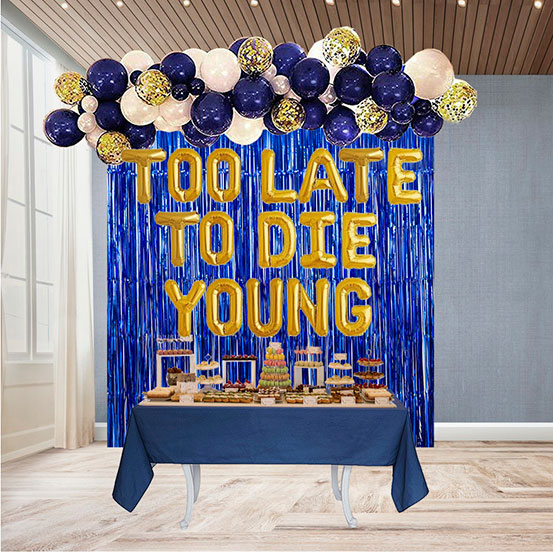 Too Late to Die Young letter balloons used as dessert table backdrop