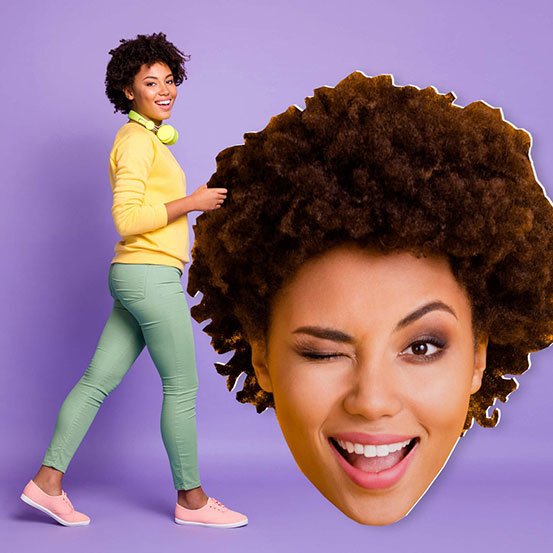 woman holding 5ft big head cut out of her own head
