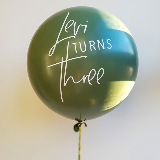 Levi Turns Three decal applied to green balloon