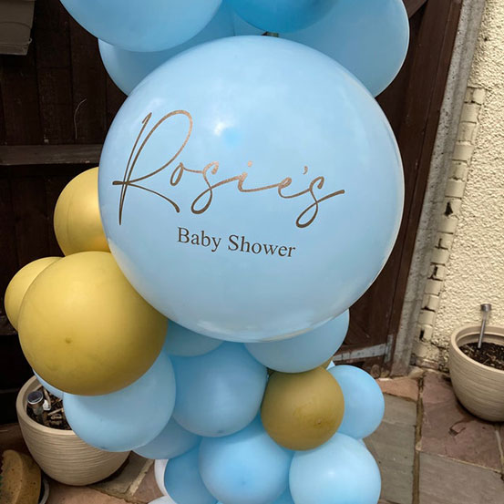 Rosie's Baby Shower decal applied to pale blue balloon
