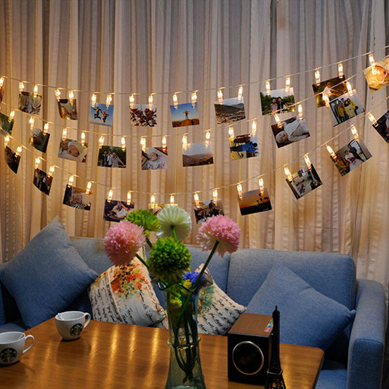 photos hung on LED photo clip string lights