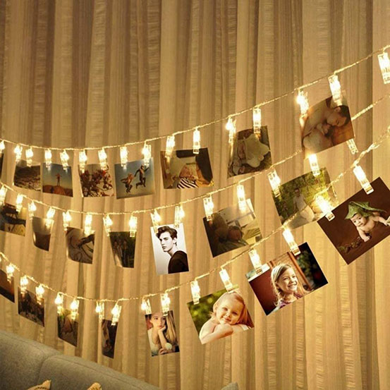 photos hung on LED photo clip string lights