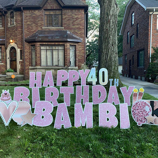 Happy 40th Birthday Bambi yard card on front lawn of house