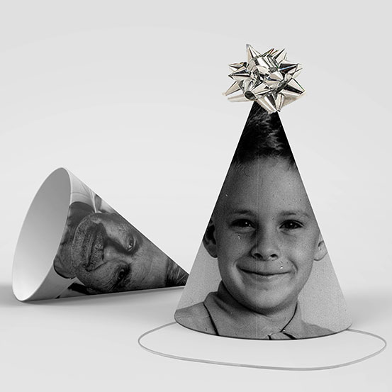 two black and white photo party hats, one showing the birthday boy now and one as a baby