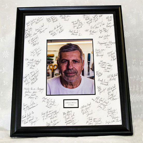 custom 50th birthday framed signing poster guestbook alternative with photo of birthday boy surrounded by handwritten messages