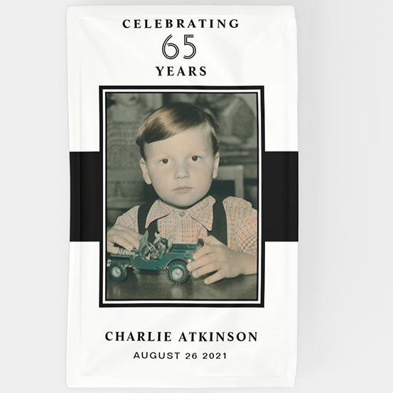 Celebrating 65 years custom photo banner showing birthday boy as a baby