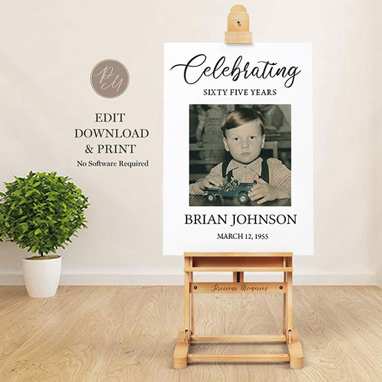 celebrating 65 years sign with photo of birthday boy as a baby displayed on an easel