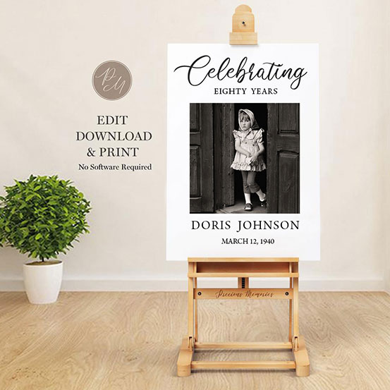 celebrating 80 years sign with photo of birthday boy as a baby displayed on an easel