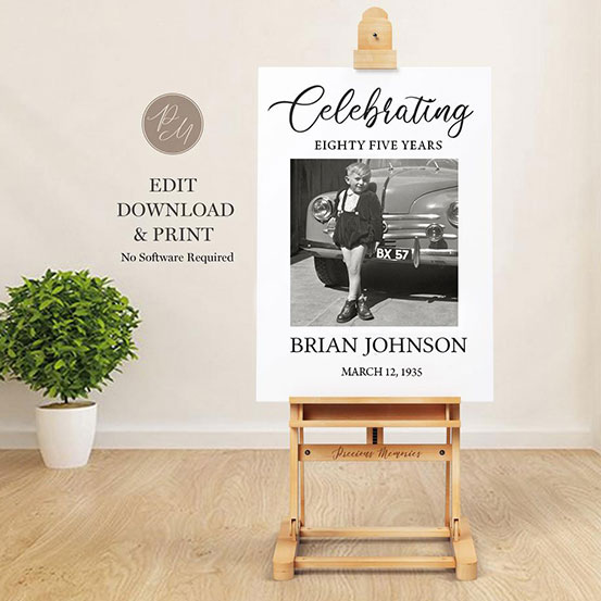celebrating 85 years sign with photo of birthday boy as a baby displayed on an easel