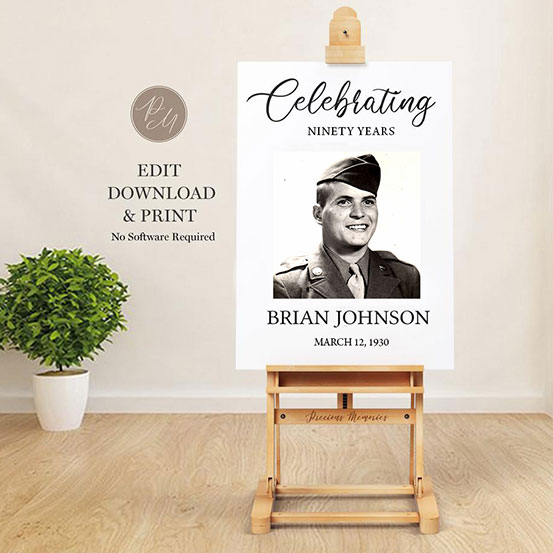 celebrating 90 years sign with photo of birthday boy as a baby displayed on an easel