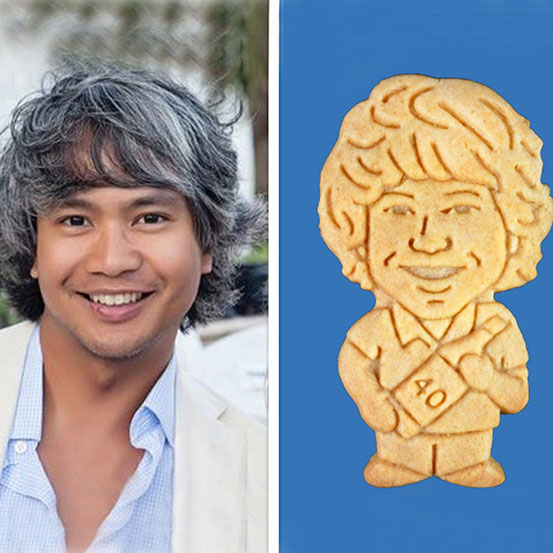 asian man alongside a custom characature cookie of himself
