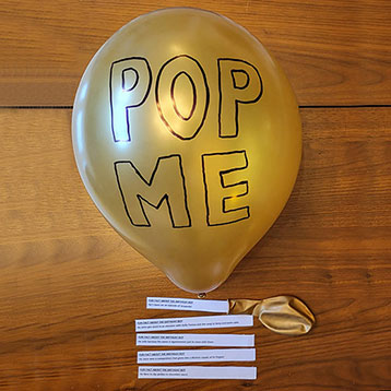 Fun Fact filled gold Pop Me balloons