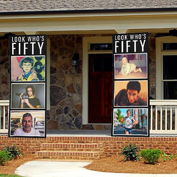 look who's 50 photo banners at house entrance