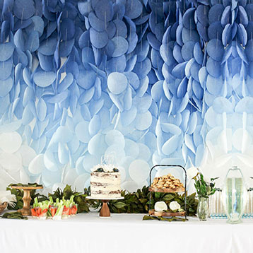 blue white ombré paper garland dessert table backdrop;