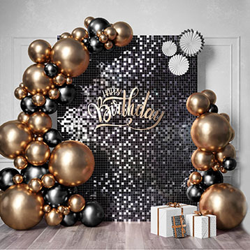 black sequin birthday backdrop board with gold balloon garland